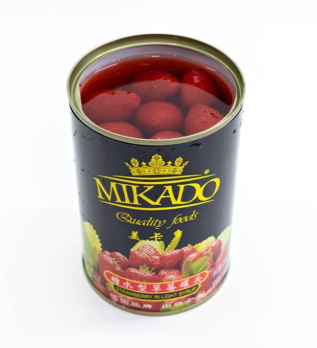 premium canned strawberry packed in glass jars and printed tins