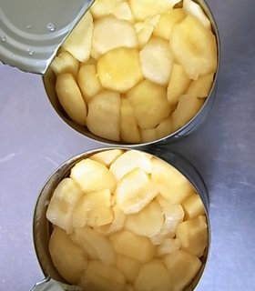 peeled apple chunks in tin can
